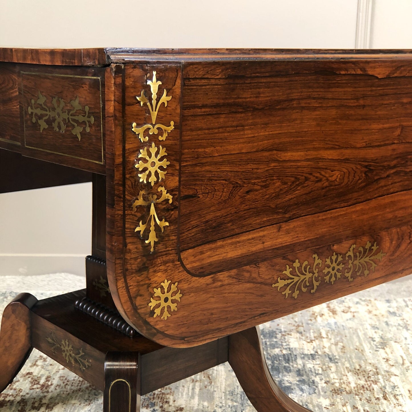 Regency rosewood and brass inlaid sofa table